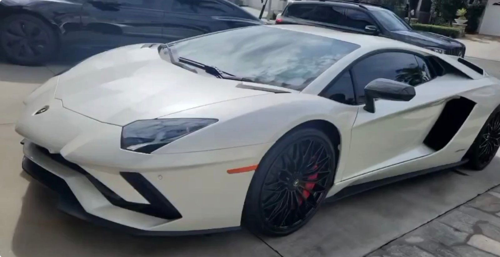 Luxury black sports car detailed by Rolando's Mobile Detailing in Orange County